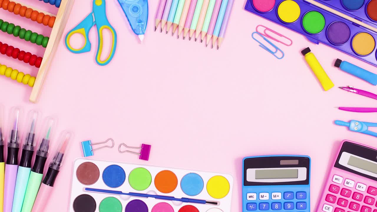 Back to school frame on pastel pink theme made of school accessories. Stop motion