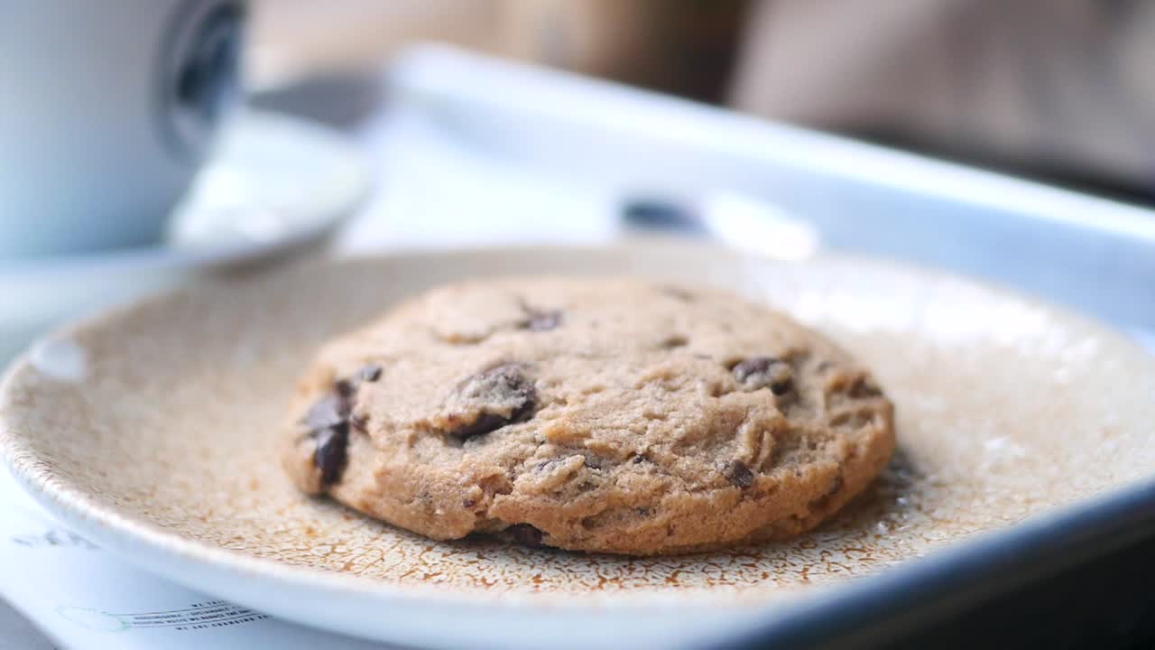 Chocolate Chip Cookie being picked up