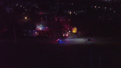 night aerial shot of ambulance and police cars