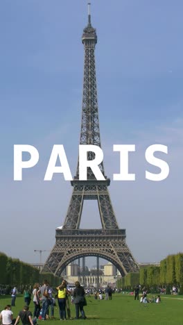 Vertical-Video-Of-Eiffel-Tower-With-Tourists-In-France-Overlaid-With-Animated-Graphic-Spelling-Out-Paris