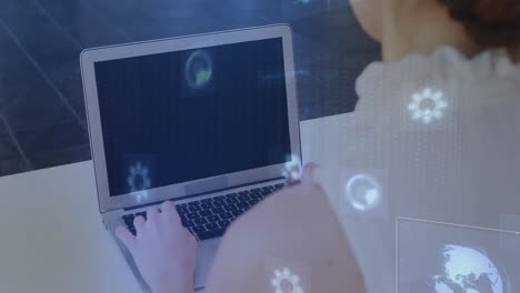 person working on laptop with digital data processing animation overlay