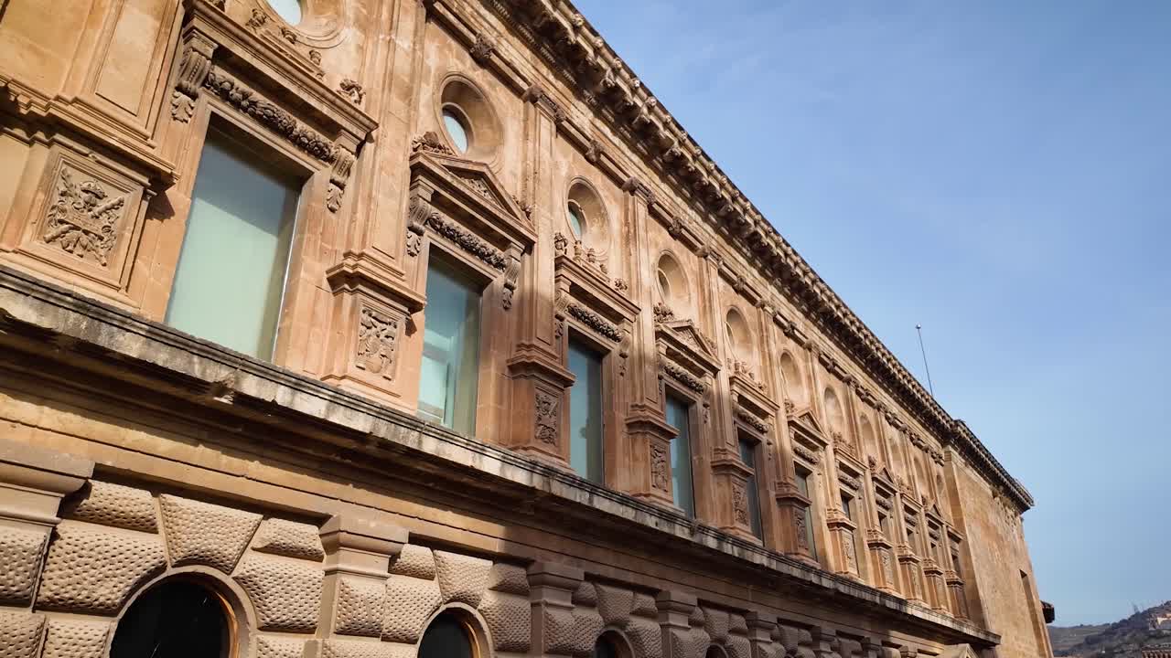 Panoramic shot highlighting the details of the side facade of the Palace of Carlos V within the monumental complex of the Alhambra in Granada, Spain