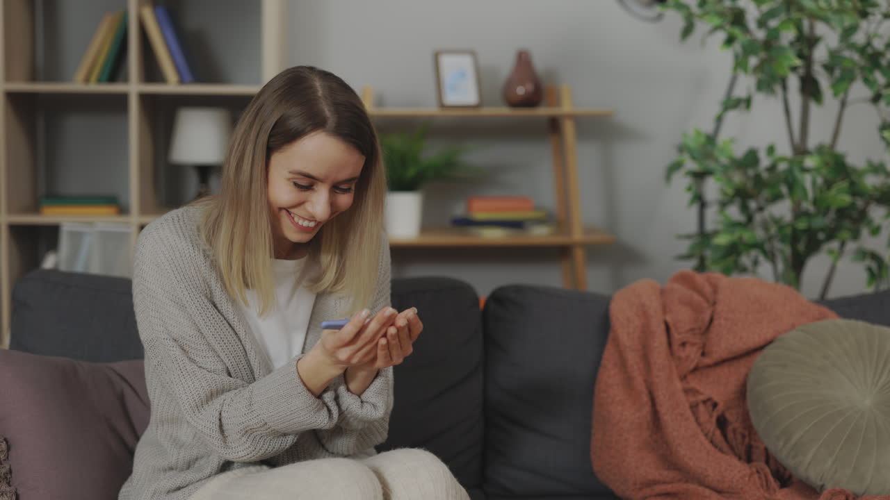 Woman Excited About Positive Pregnancy Test