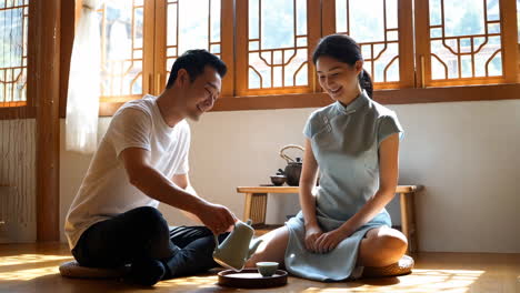couple enjoying a tea ceremony in traditional clothing