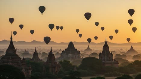 a serene sunrise over ancient structures: hot air balloons gracefully floating above the enchanting landscape of historical temples and monuments in early morning light