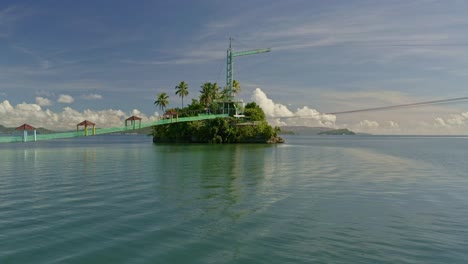 Low-angle-locked-off-view-of-Bacuag-Hanging-Bridge-and-Octopus-Islet