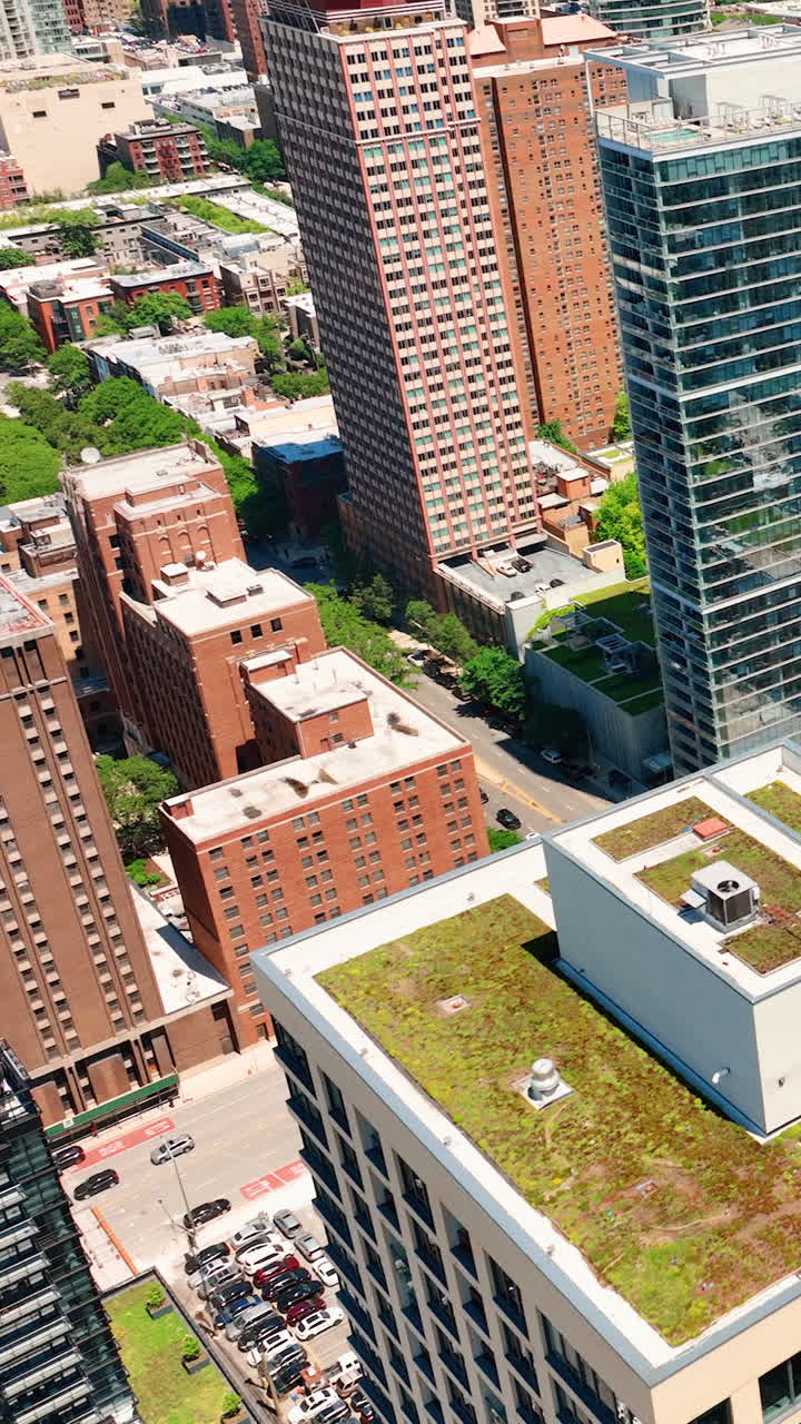 Top view of rooftops in downtown Chicago. Sunny day. City streets with cars. Vertical video
