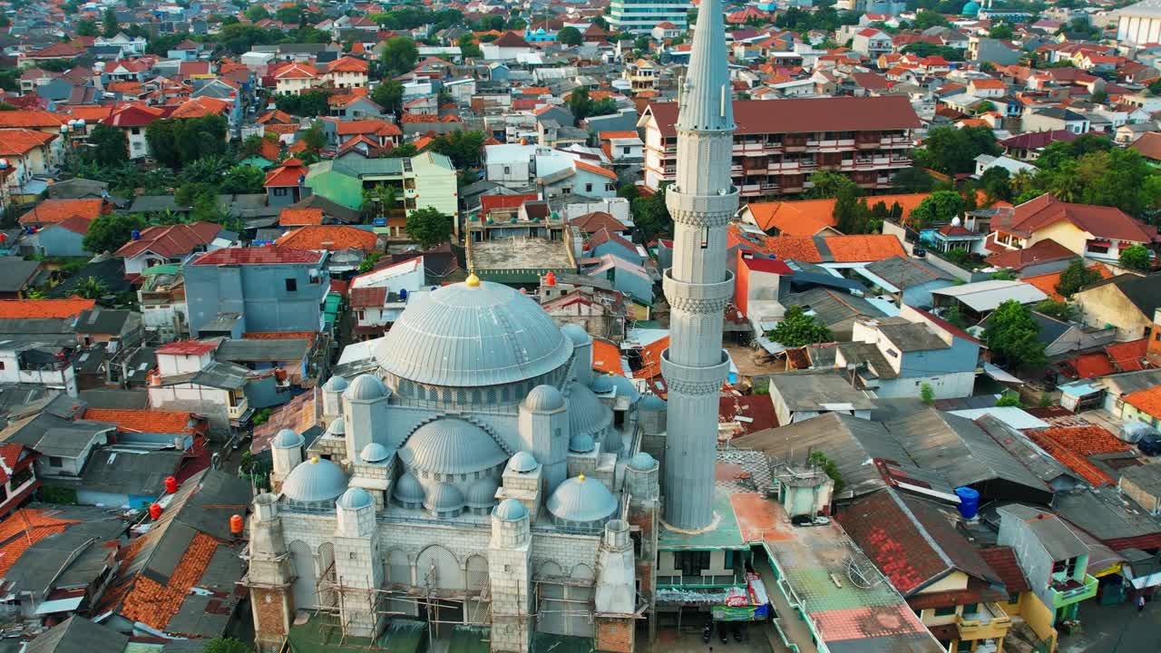 Aerial view of the largest Mosque in Jakarta. Ramadan and Eid Concept and noise cloud when sunset or sunrise view