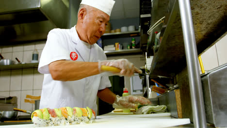 male chef preparing sushi in kitchen 4k