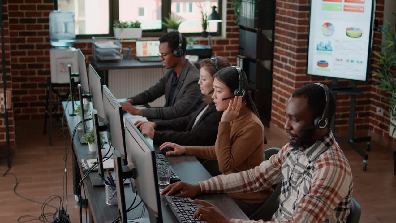 Diverse team of people talking to clients on phone helpline