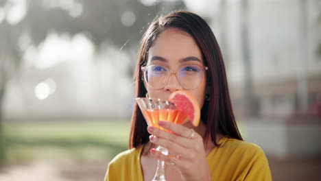 A woman enjoying a cocktail