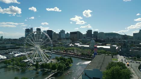 4K-Cinematic-urban-drone-footage-of-a-panoramic-aerial-view-of-downtown-Montreal,-Quebec-on-a-sunny-day-from-the-Old-Port