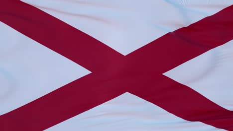 flag of alabama state, region of the united states, waving at wind