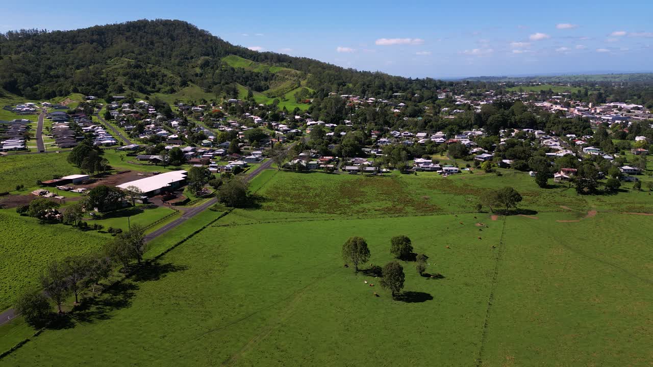 Rising aerial footage of farmland surrounding Kyogle in Northern New South Wales, Australia