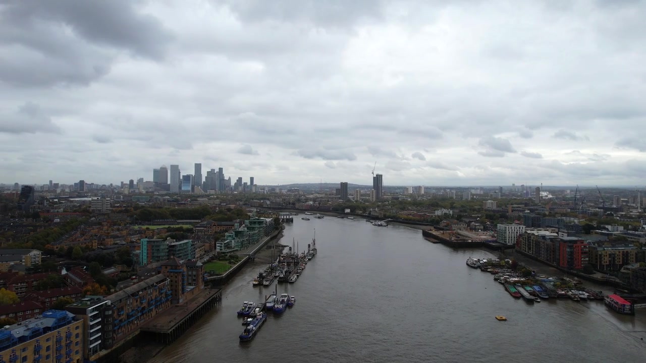 Harbor area of London with Canary Wharf in background. Aerial