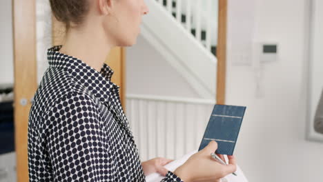 Female-engineer-team-leader-presenting-solar-energy-concept-to-tech-startup-investors-in-Diverse-group-business-meeting--trendy-hipster-office