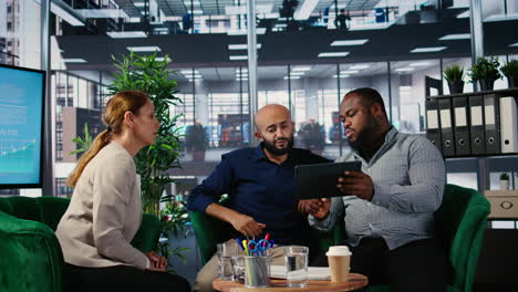 vertical video office meeting featuring diverse professionals engaged in company planning