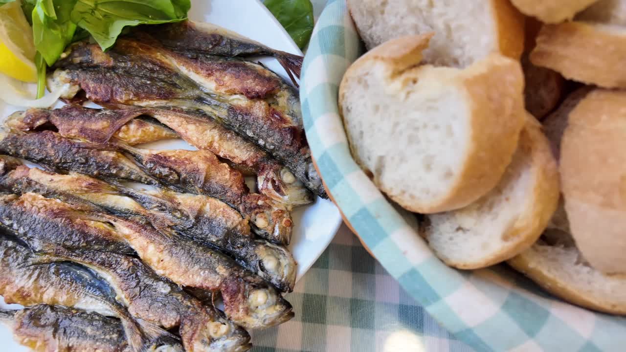 Fried fish with lemon and greens