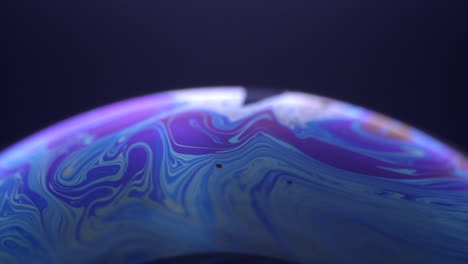 beautiful blue bubble planet in black background -close up