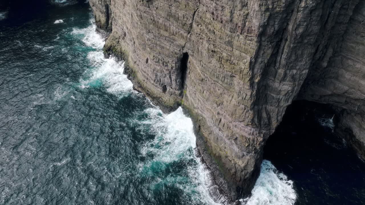Sørvágsvatn lake cliffs meeting ocean waves, faroe islands, tranquil mood, aerial view