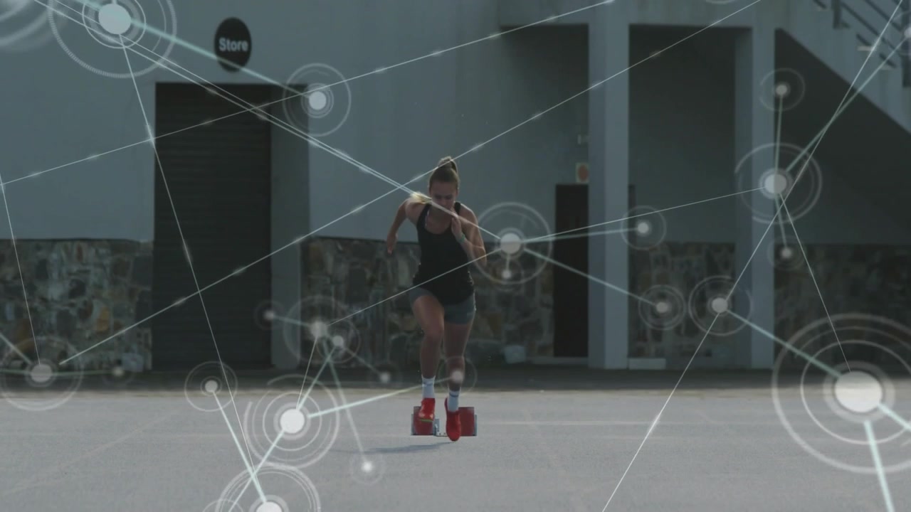On cue female sprinter launching from red blocks sprinting into network overlay showing tech growth