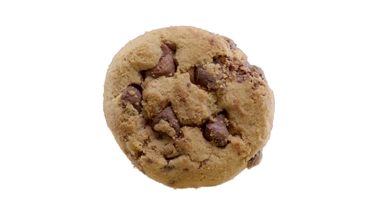 Cookie made of chocolate turns forward to camera and breaks