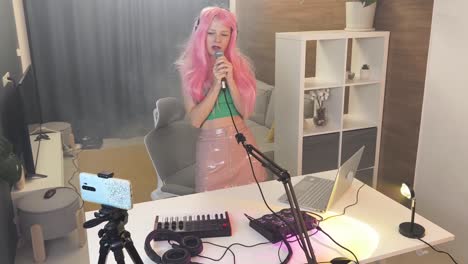 woman singing in home recording studio