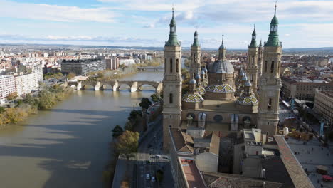 aerial view of basilica del pilar and ebro river with bridges in zaragoza spain