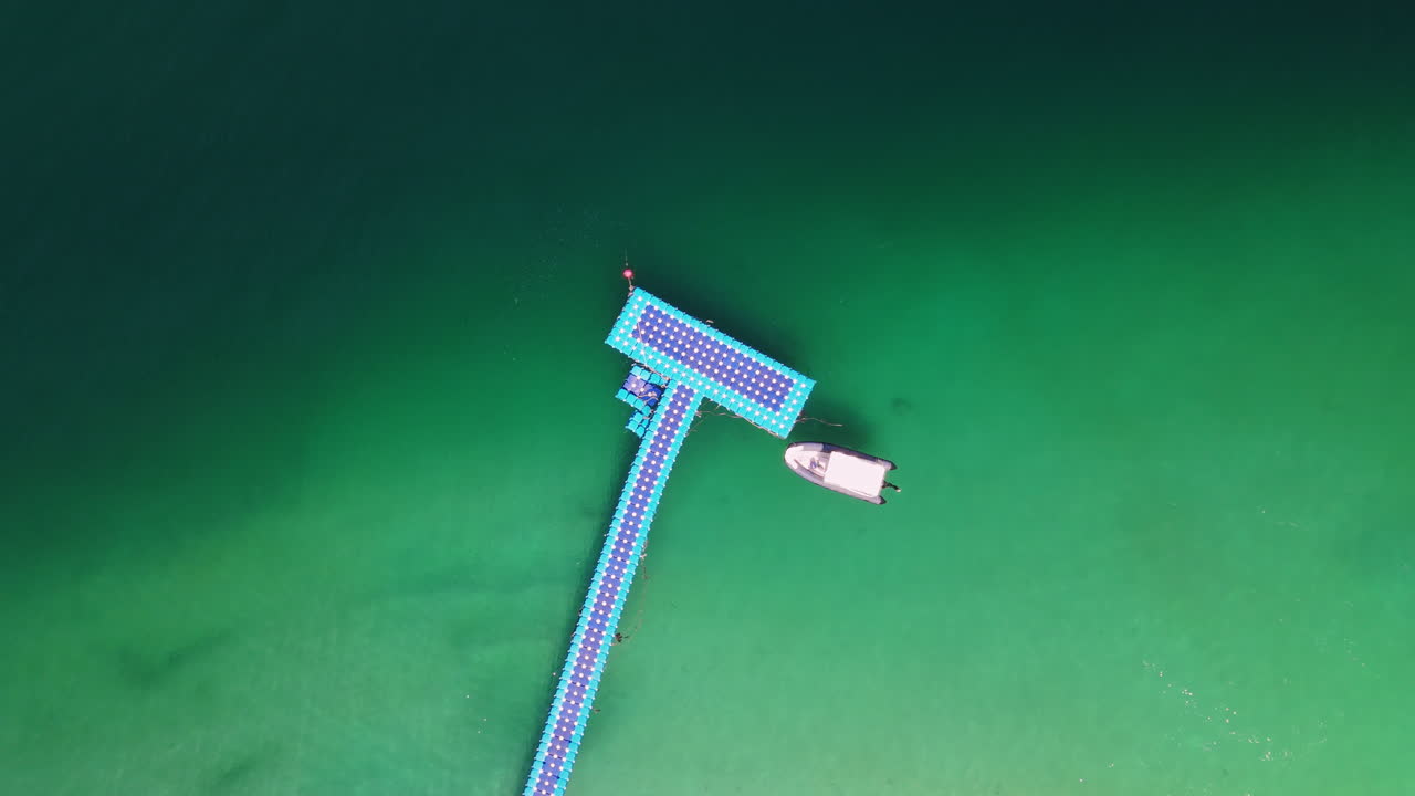 Floating Dock and Boat in Turquoise Water