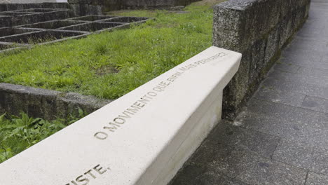 stone bench with portuguese inscription at historical site