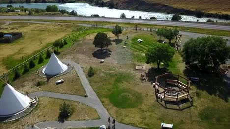 drone shot over tipi hotel in montana next to yellowstone river