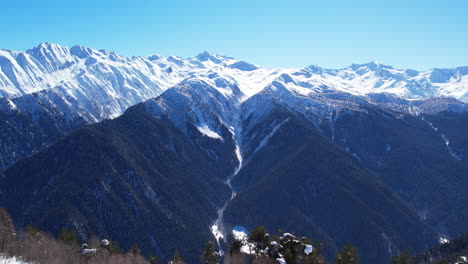 Winter drone flight over Mestia`s mountains in gerorgia. Hatsvali Ski Resort next to Uschba and Tetnuldi Peak