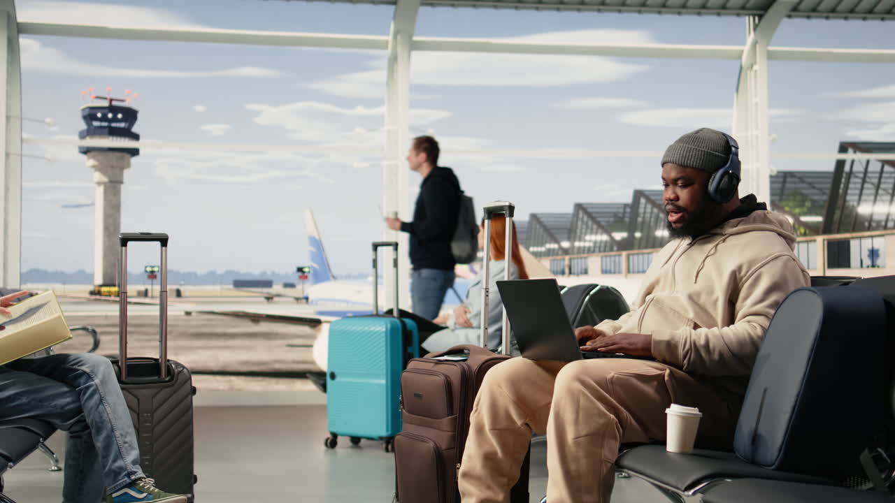 African american man on video conference call using airport internet