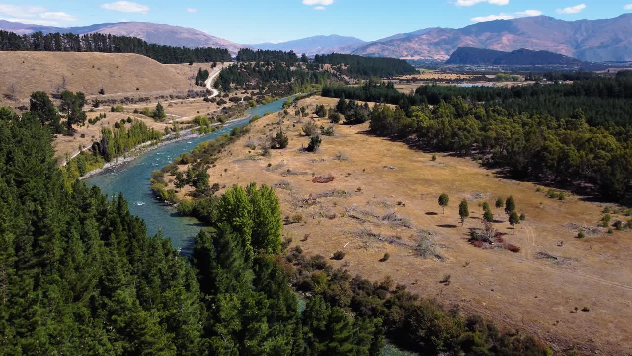 AERIAL Orbiting Shot of a Beautiful River and Mountainous Landscape of South Island, New Zealand