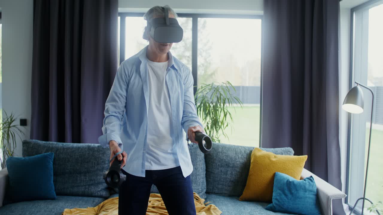 Senior Man Enjoys Virtual Reality Experience at Home