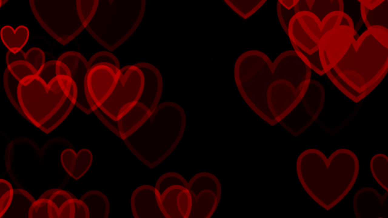 corazones rojos sobre fondo negro