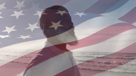 animación de la bandera de los estados unidos de américa sobre un hombre afroamericano en la playa