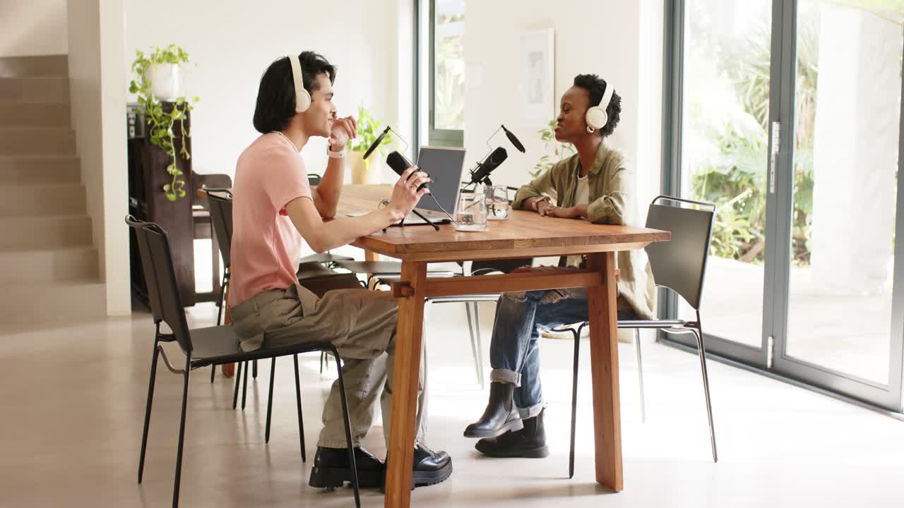 Diverse hosts after intro at home adjusting laptop speaking into microphones checking phone nodding