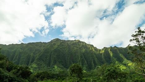 time lapse with rays of light passing over the koolau mountains in the beautiful city of kaneohe, hawaii