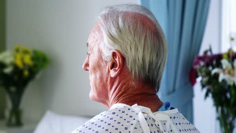 senior patient sitting in a thoughtful mood