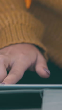 lady with manicure types on modern tablet in tourist camp on meadow in early morning closeup slow motion