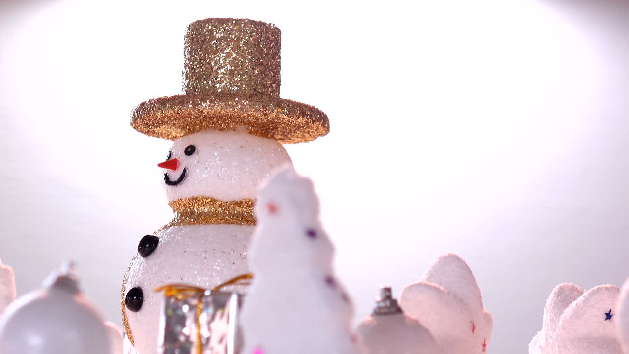Snow man and gift box decoration on snow for new year or christmas holiday international.