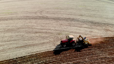 tractor with seeder in the field