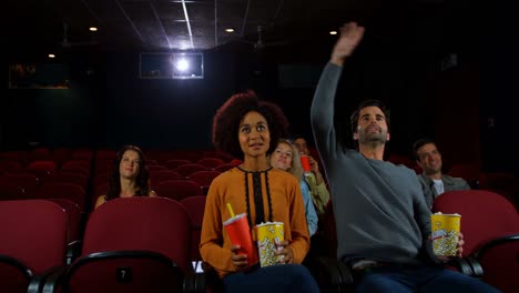 couple watching movie in theater 4k