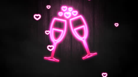 Fly-neon-hearts-and-wine-glasses-on-wood-in-night-club