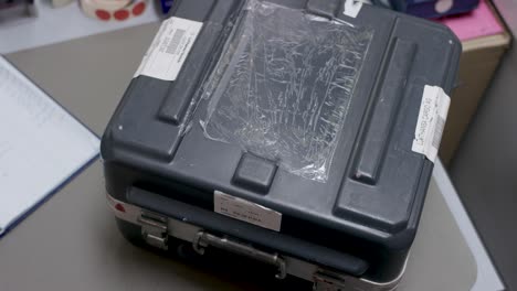 person handling a cargo box