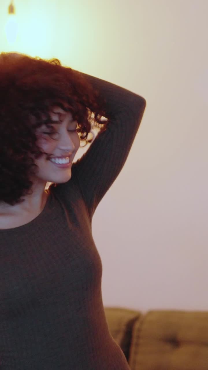 Happy group of multiethnic friends dancing at home