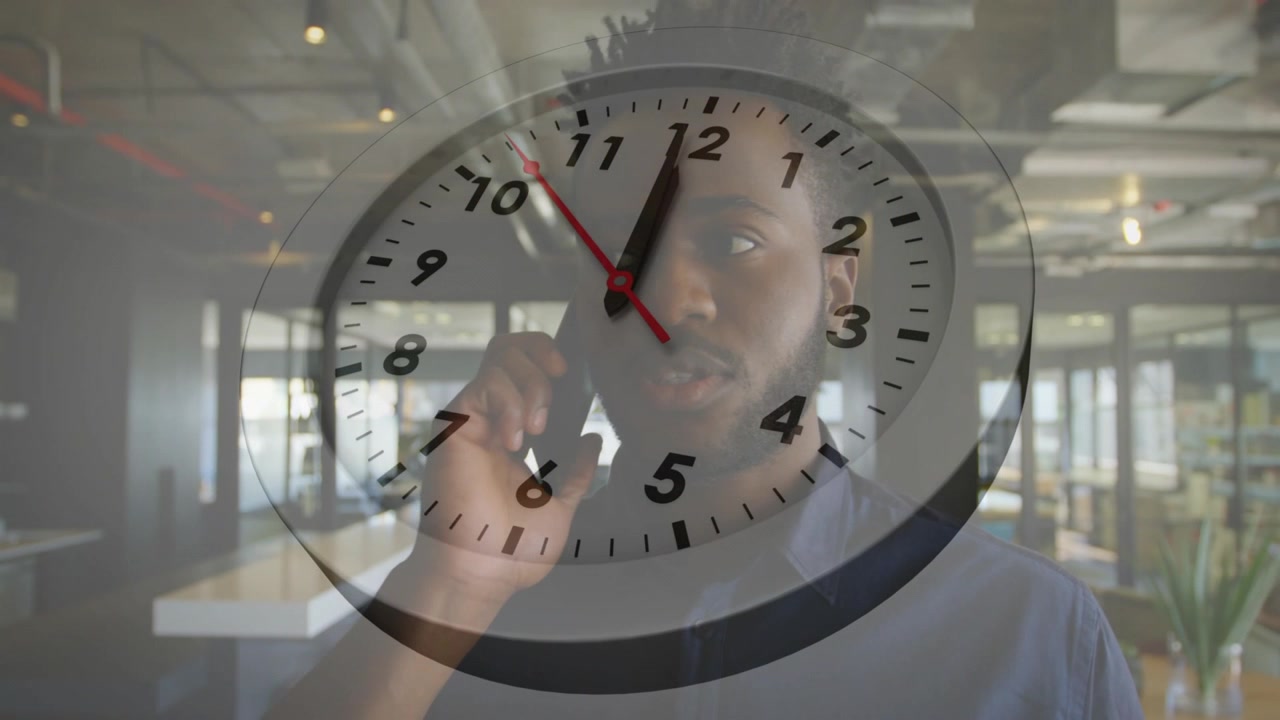 Male staff holding phone on call, shifting listening or talking as clock overlay marking time for wo