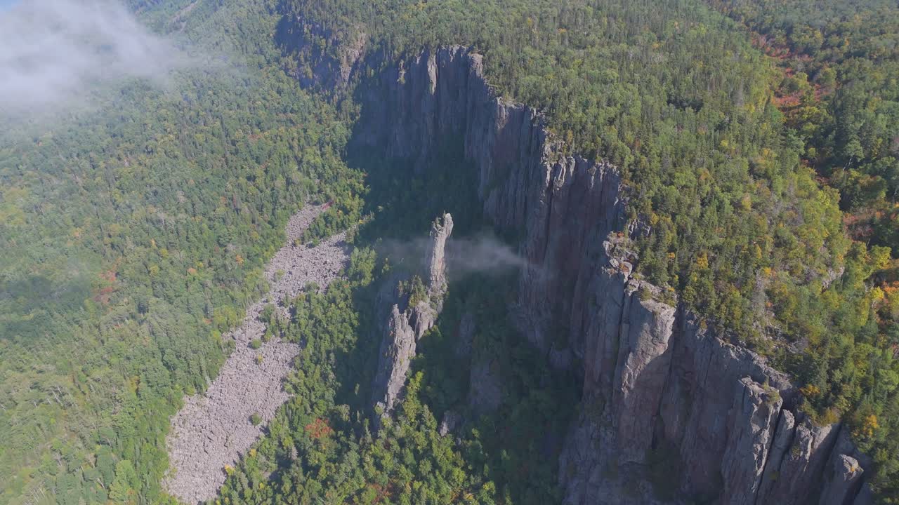 A stunning view of the towering cliffs at Sleeping Giant, Ontario, surrounded by dense green forest