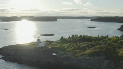 Lighthouse-with-sunset-and-ferry